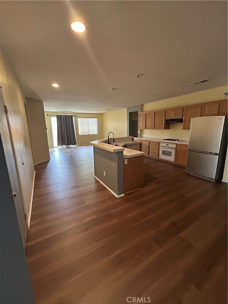 12673 Field Way Victorville, CA 92395 - Photo 5 of 15 a view of a kitchen with furniture and wooden floor