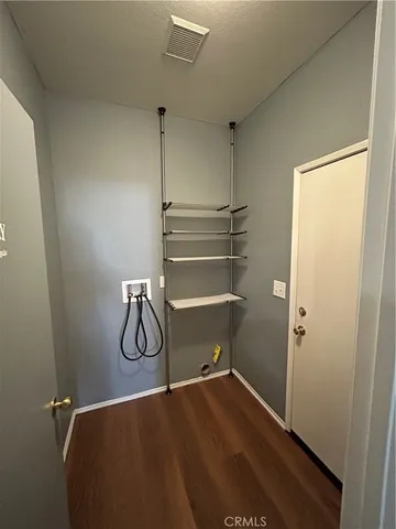 a view of storage and utility room with empty racks