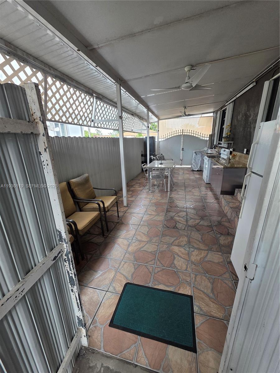 3600 East 5th Avenue Hialeah, FL 33013 - Photo 6 of 13 a view of a chairs and table in the back yard of a building