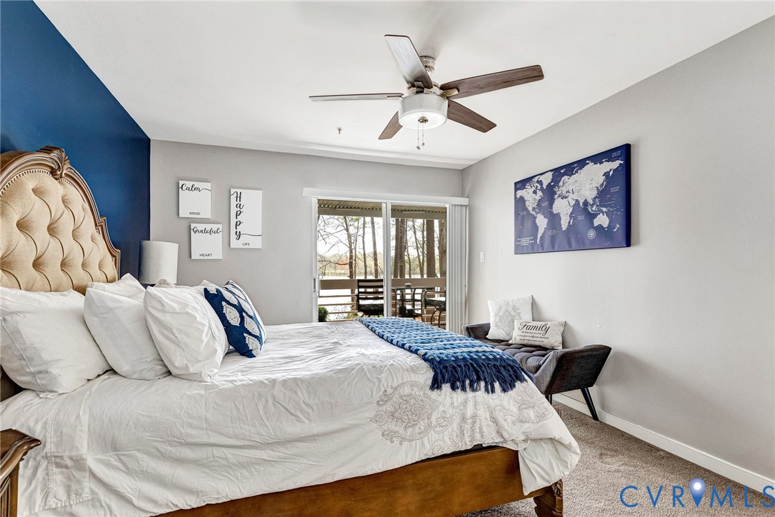 102 Water Pointe Court Midlothian, VA 23112 - Photo 22 of 35 a bedroom with a bed and a chandelier