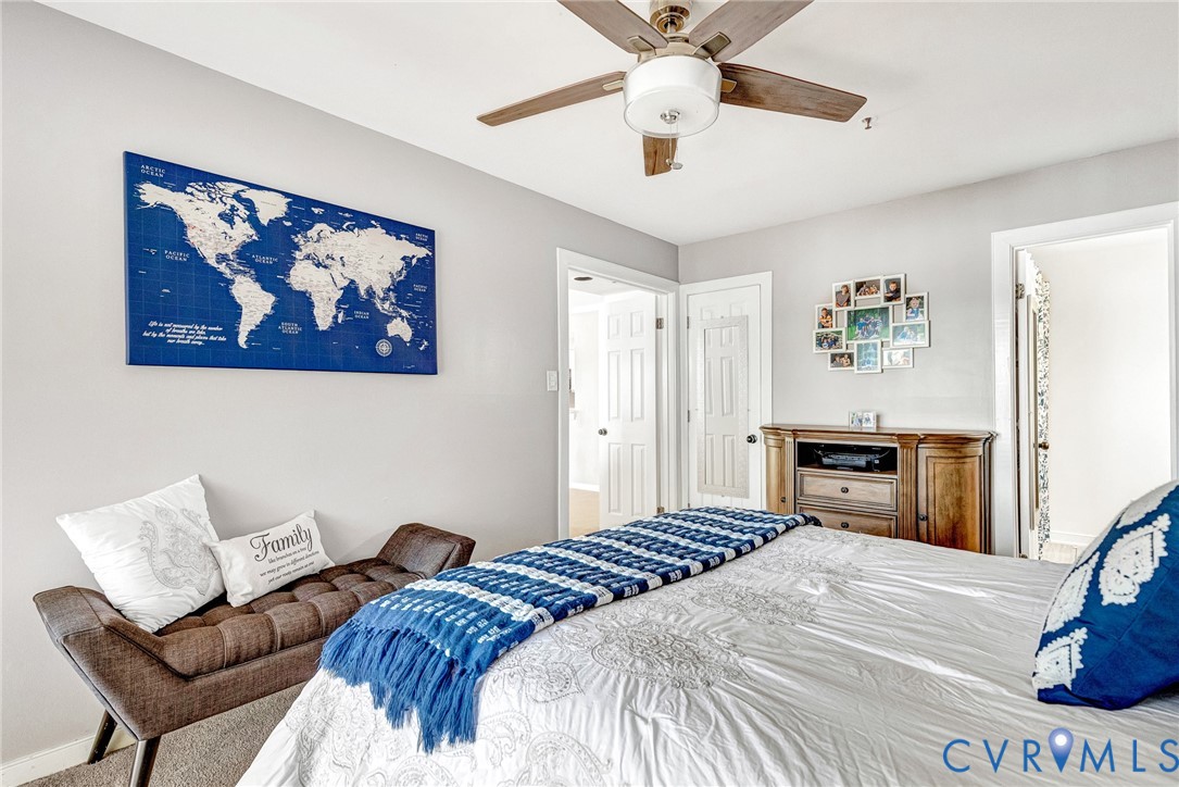 102 Water Pointe Court Midlothian, VA 23112 - Photo 24 of 35 a bedroom with a bed and a chandelier