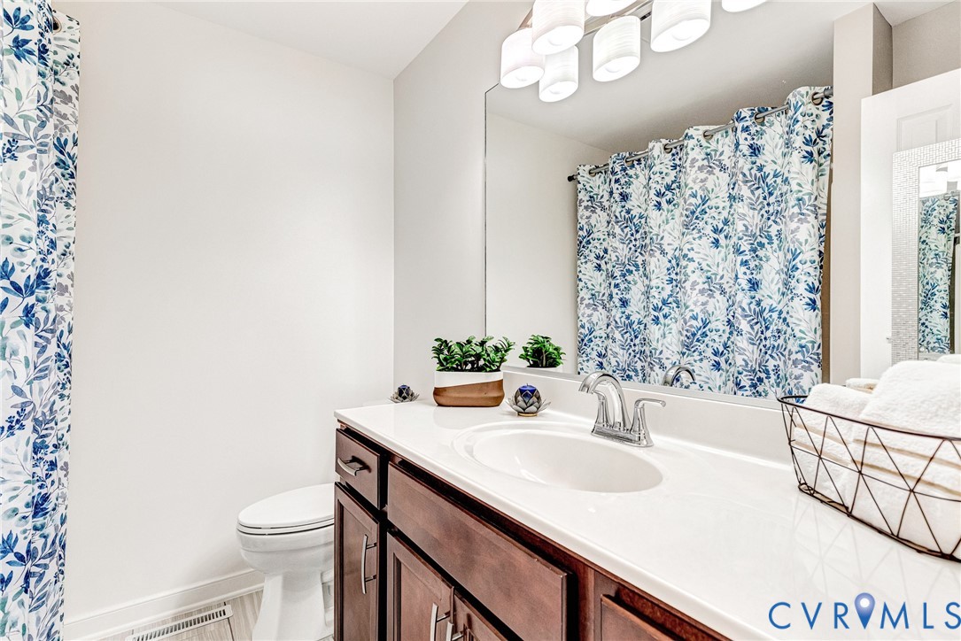 102 Water Pointe Court Midlothian, VA 23112 - Photo 25 of 35 a bathroom with a sink a toilet and shower