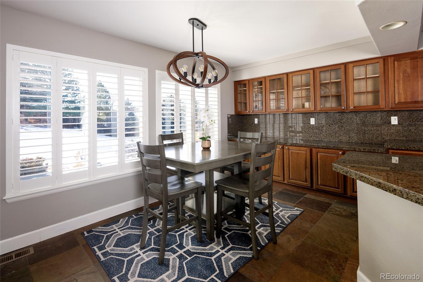 10269 Fawnbrook Court Highlands Ranch, CO 80130 - Photo 14 of 45 a view of a dining room with furniture window and outside view