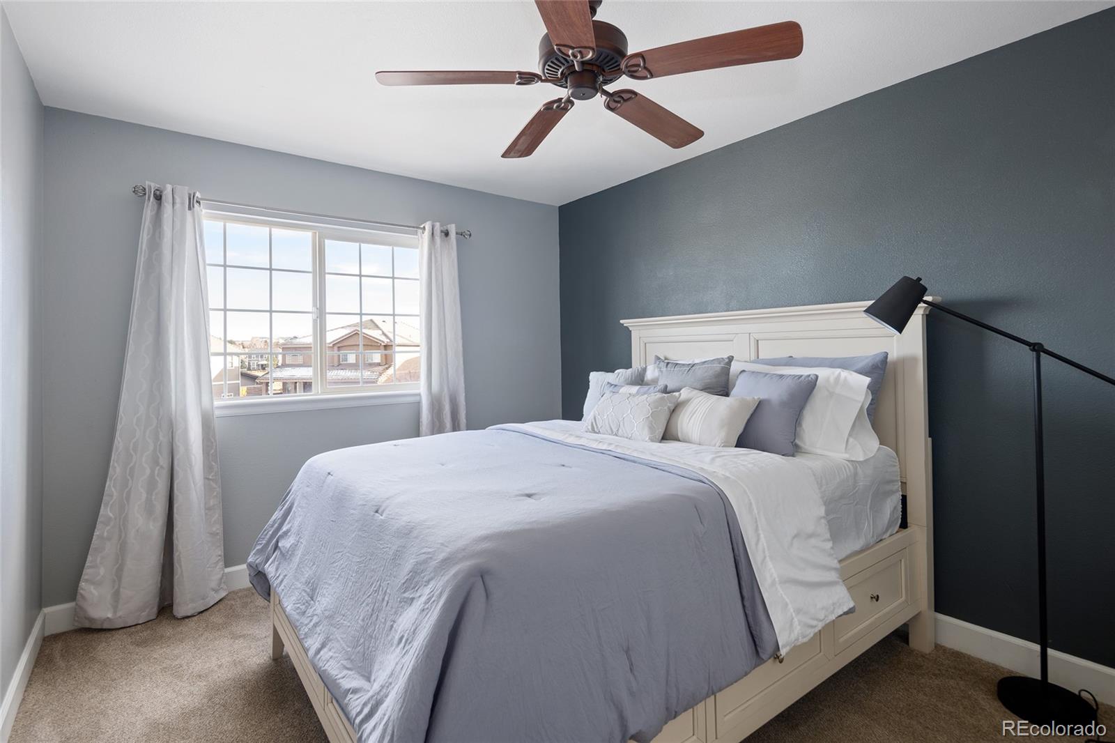 10269 Fawnbrook Court Highlands Ranch, CO 80130 - Photo 27 of 45 a bedroom with a bed and a window