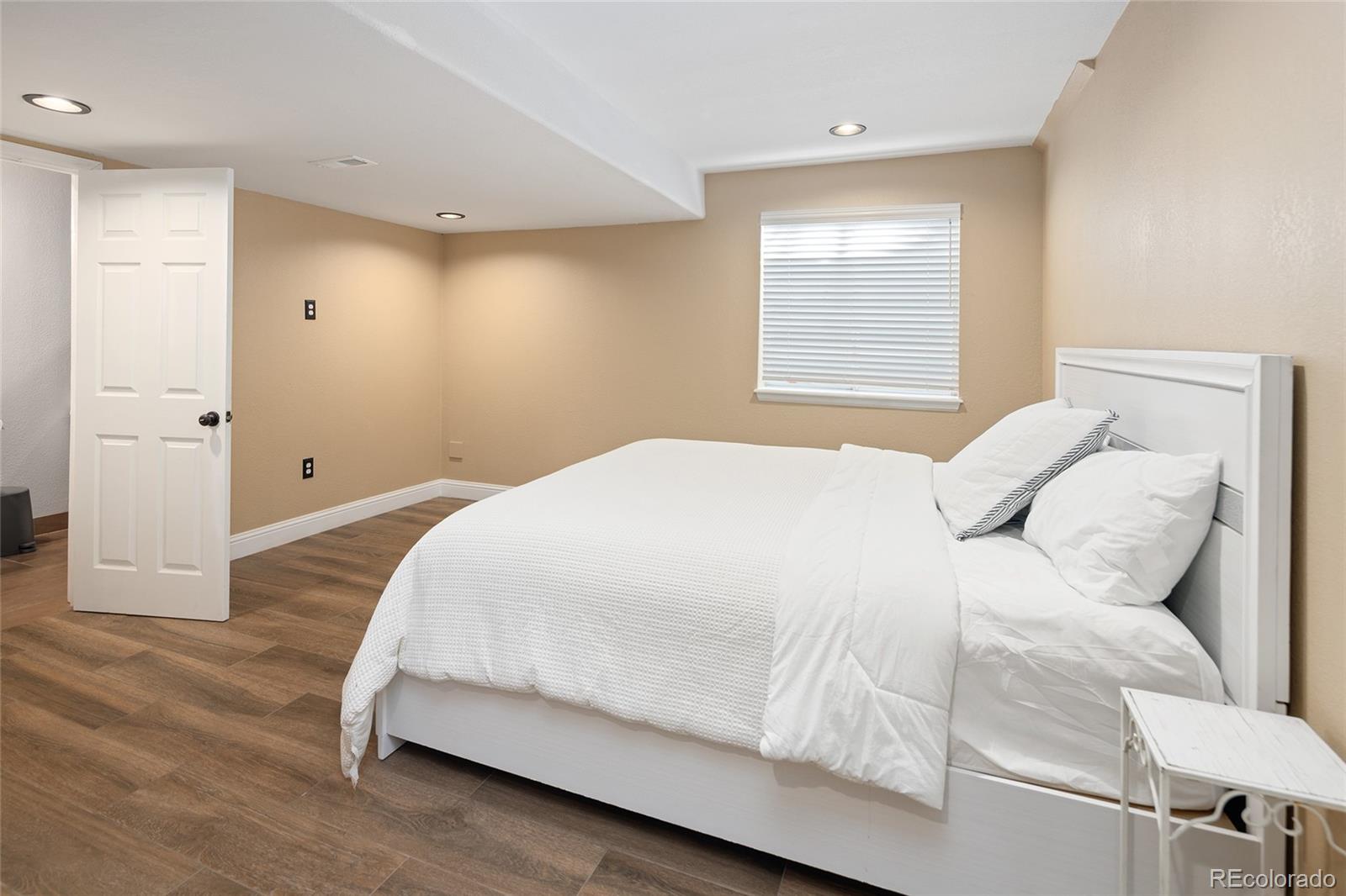 10269 Fawnbrook Court Highlands Ranch, CO 80130 - Photo 33 of 45 a bedroom with a bed and a couch