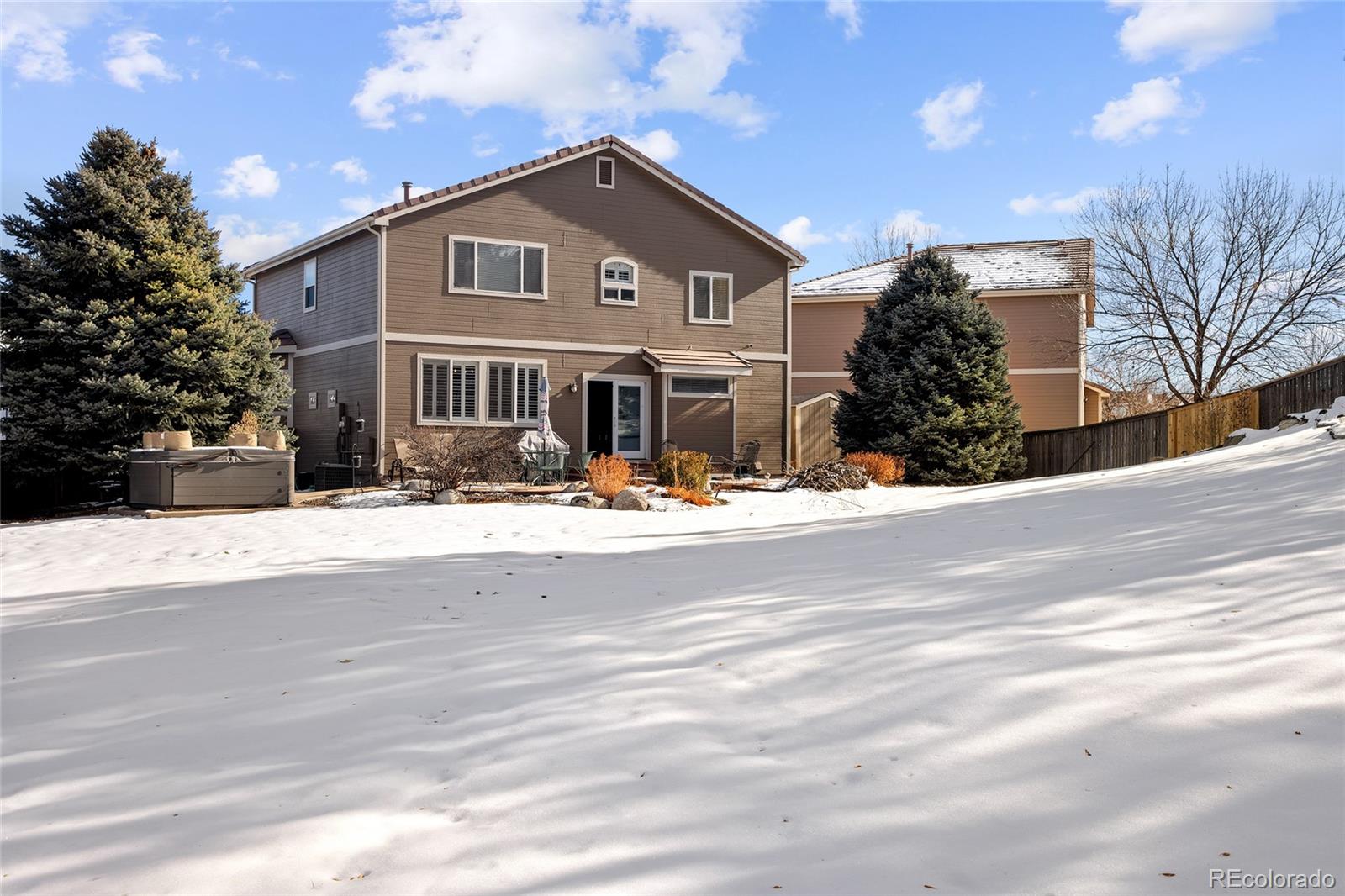 10269 Fawnbrook Court Highlands Ranch, CO 80130 - Photo 35 of 45 a front view of a house with a yard