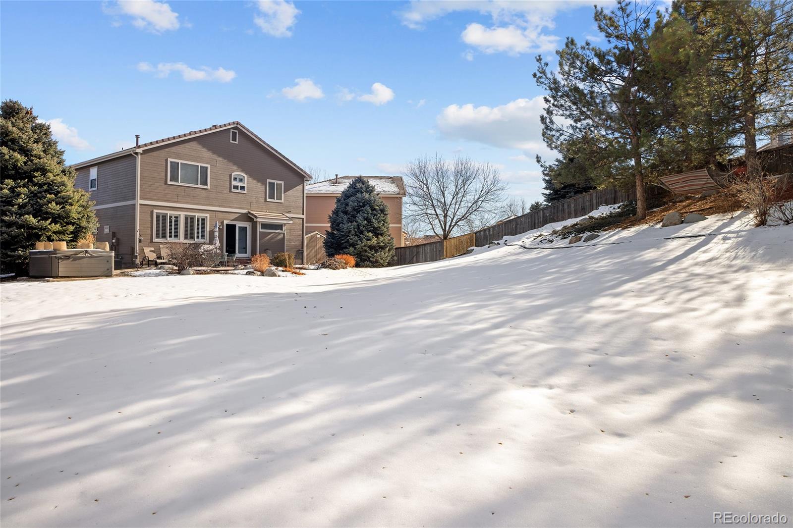 10269 Fawnbrook Court Highlands Ranch, CO 80130 - Photo 45 of 45 a front view of a house with a snow yard