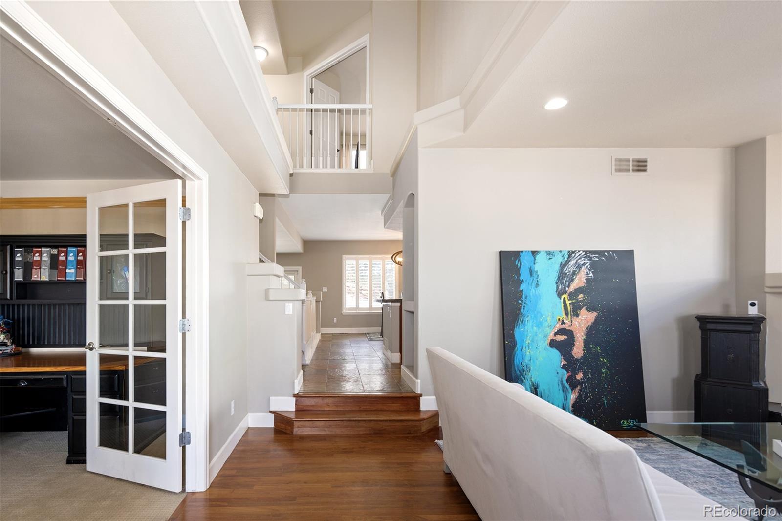 10269 Fawnbrook Court Highlands Ranch, CO 80130 - Photo 5 of 45 a living room with furniture and a flat screen tv