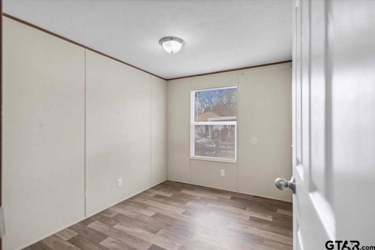 307 St Joseph Street Athens, TX 75751 - Photo 15 of 24 an empty room with windows