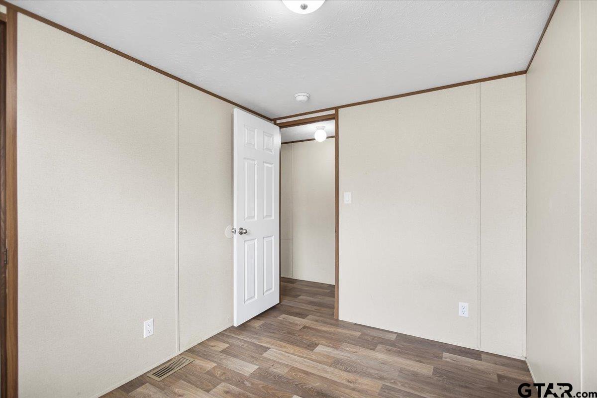 307 St Joseph Street Athens, TX 75751 - Photo 16 of 24 a view of a room with wooden floor