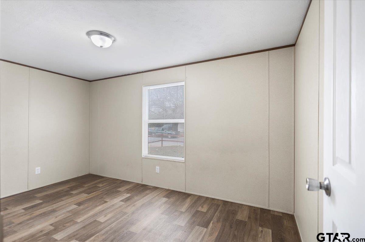 307 St Joseph Street Athens, TX 75751 - Photo 20 of 24 an empty room with windows