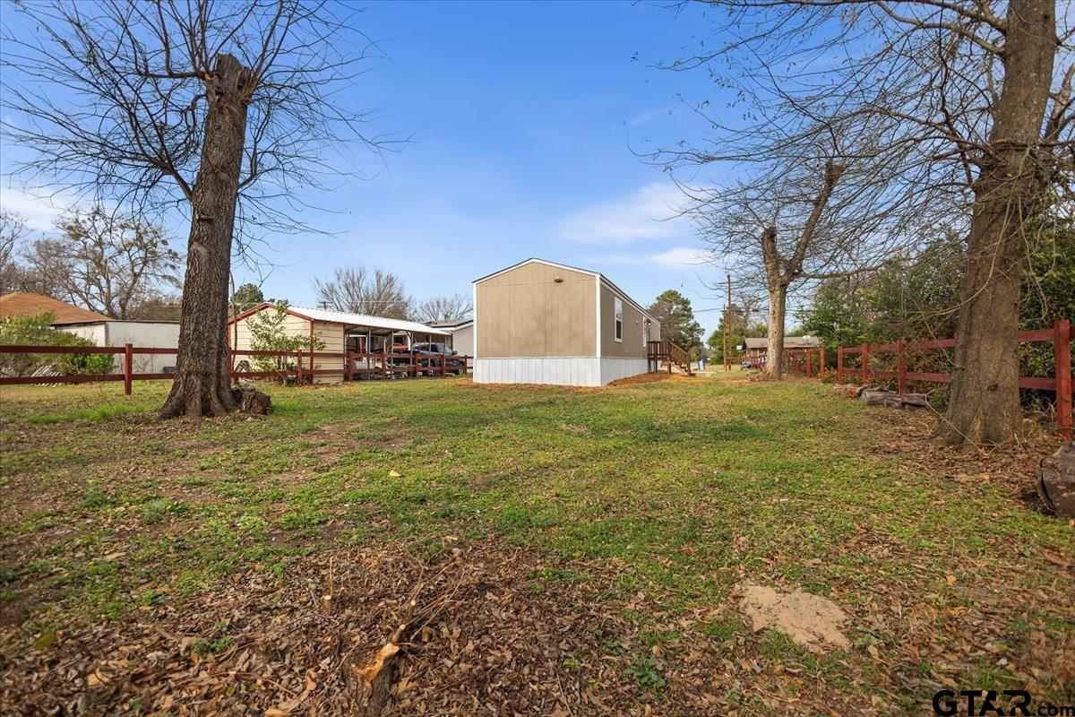 307 St Joseph Street Athens, TX 75751 - Photo 21 of 24 a view of a field with large trees