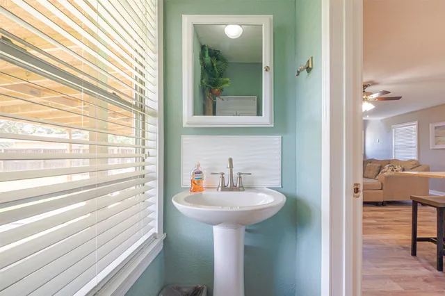 a bathroom with a sink and a mirror