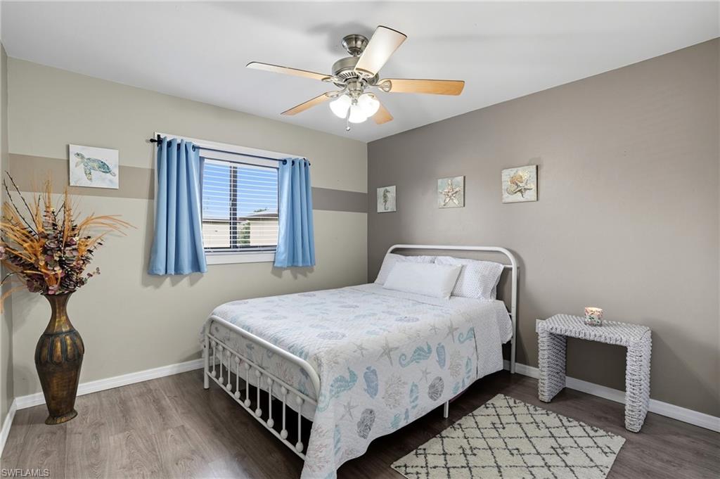 4790 South Cleveland Avenue, Unit 907 Fort Myers, FL 33907 - Photo 15 of 24 Bedroom with wood finished floors and a ceiling fan