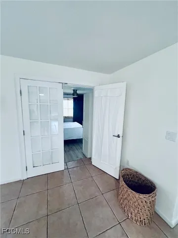 a view of room with wooden floor