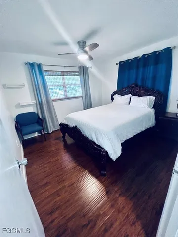 a bedroom with a bed and a mirror