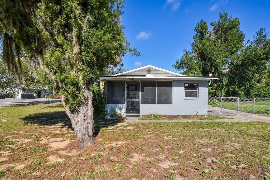 1220 Morin Street, Unit A Eustis, FL 32726 - Photo 1 of 20 a front view of a house with garden