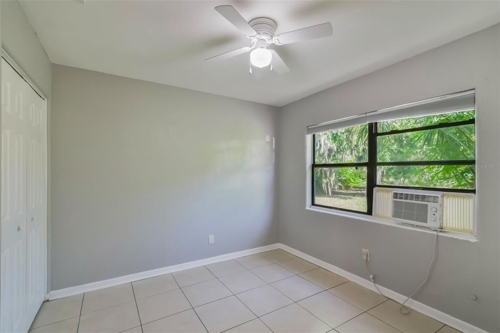 1220 Morin Street, Unit A Eustis, FL 32726 - Photo 13 of 20 a view of an empty room with a window