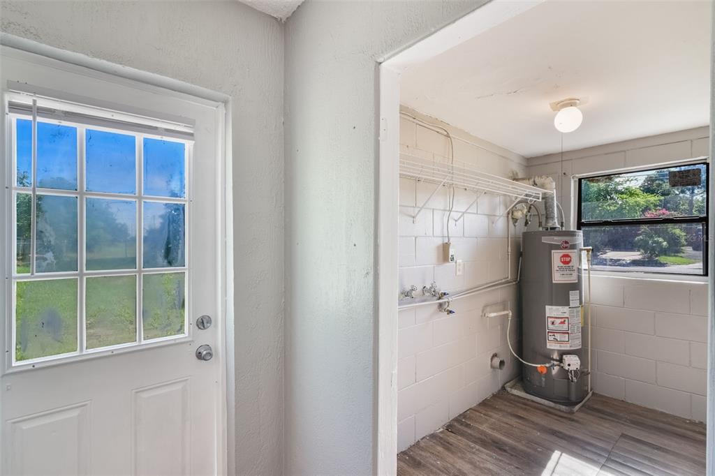 1220 Morin Street, Unit A Eustis, FL 32726 - Photo 15 of 20 a view of hallway with window and refrigerator