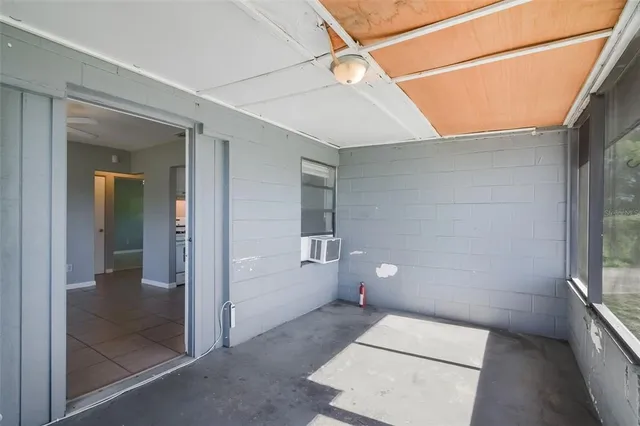 a view of a backyard with sitting area