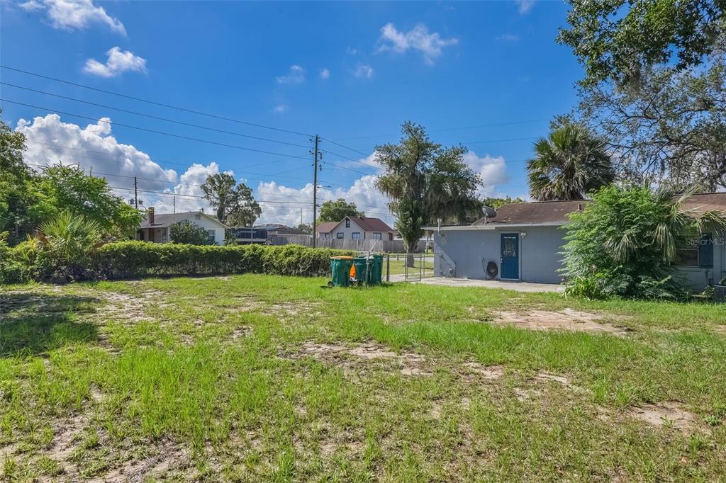 1220 Morin Street, Unit A Eustis, FL 32726 - Photo 19 of 20 a front view of house with yard and trees