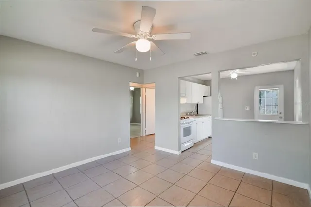 a view of kitchen with center island and stainless steel appliances