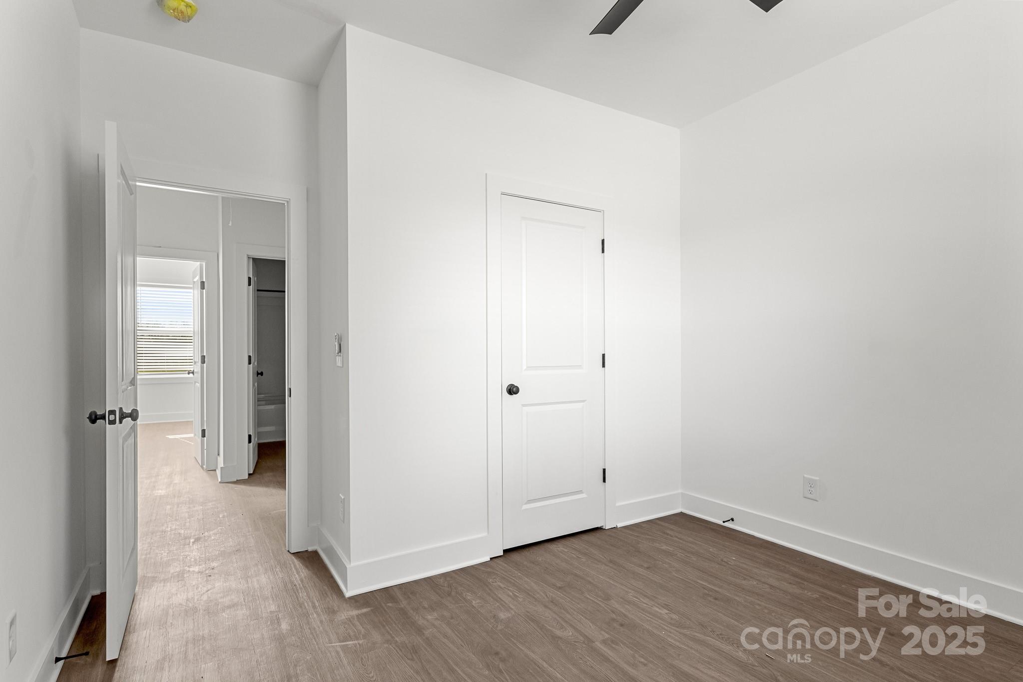 3303 Old Pageland Monroe Road Monroe, NC 28112 - Photo 23 of 37 an empty room with wooden floor and windows