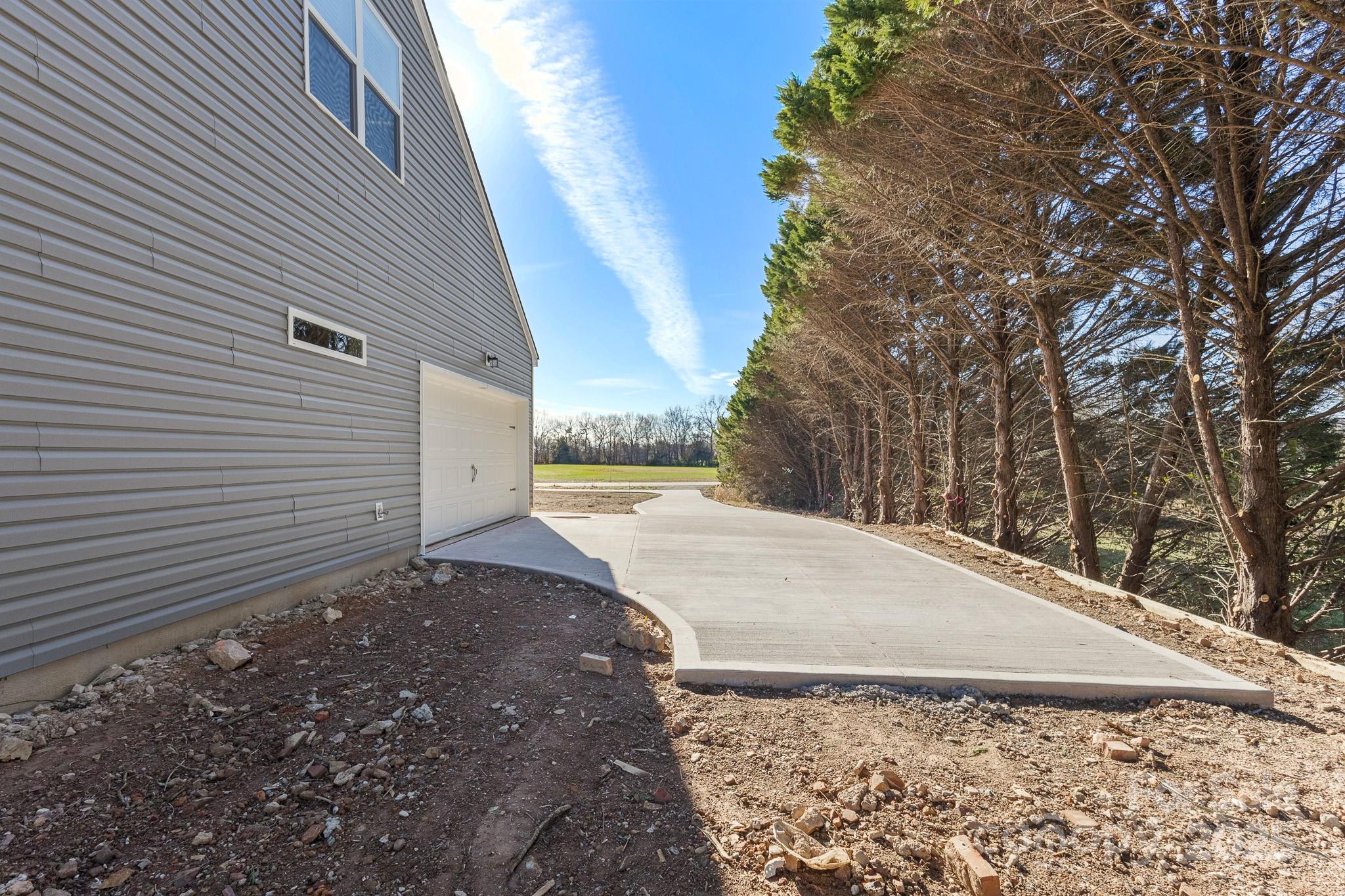 3303 Old Pageland Monroe Road Monroe, NC 28112 - Photo 34 of 37 a view of a backyard of the house