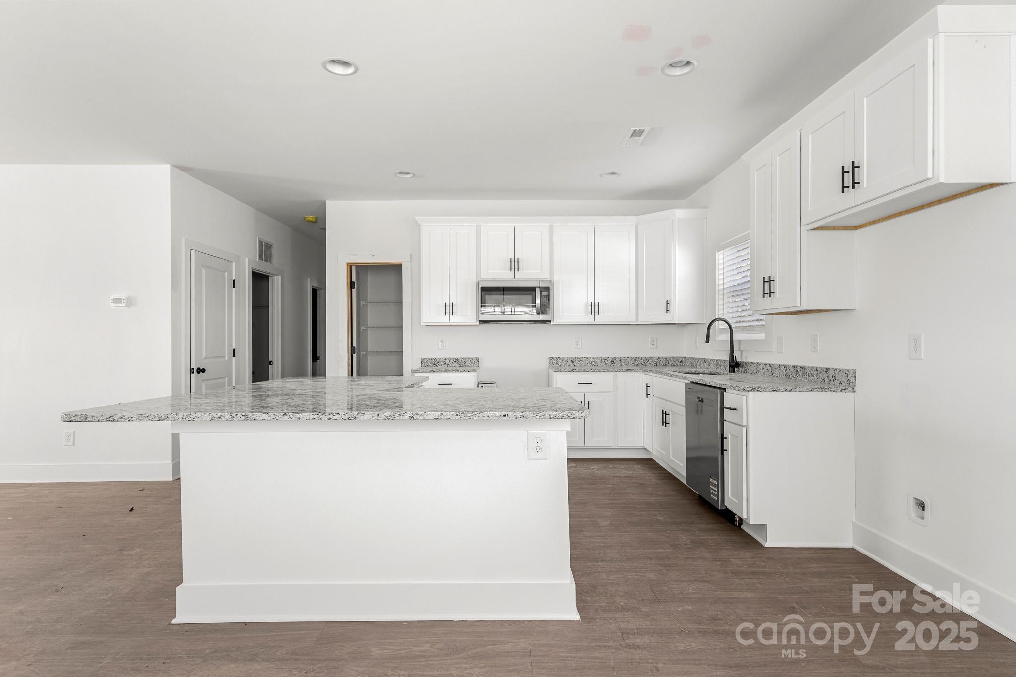 3303 Old Pageland Monroe Road Monroe, NC 28112 - Photo 9 of 37 a large kitchen with cabinets