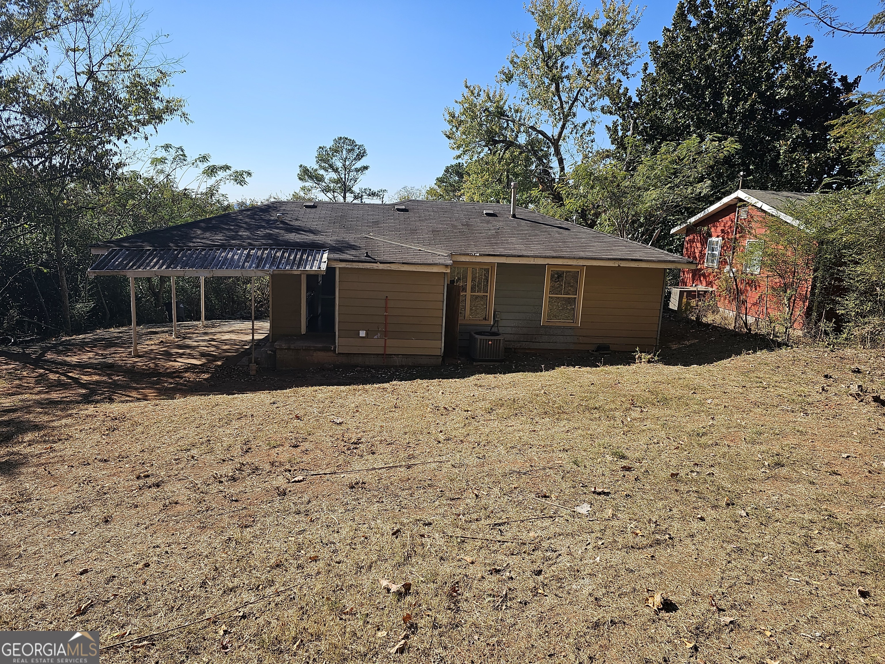 447 High Moon Drive Cartersville, GA 30121 - Photo 3 of 12 a front view of house with yard and trees in the background