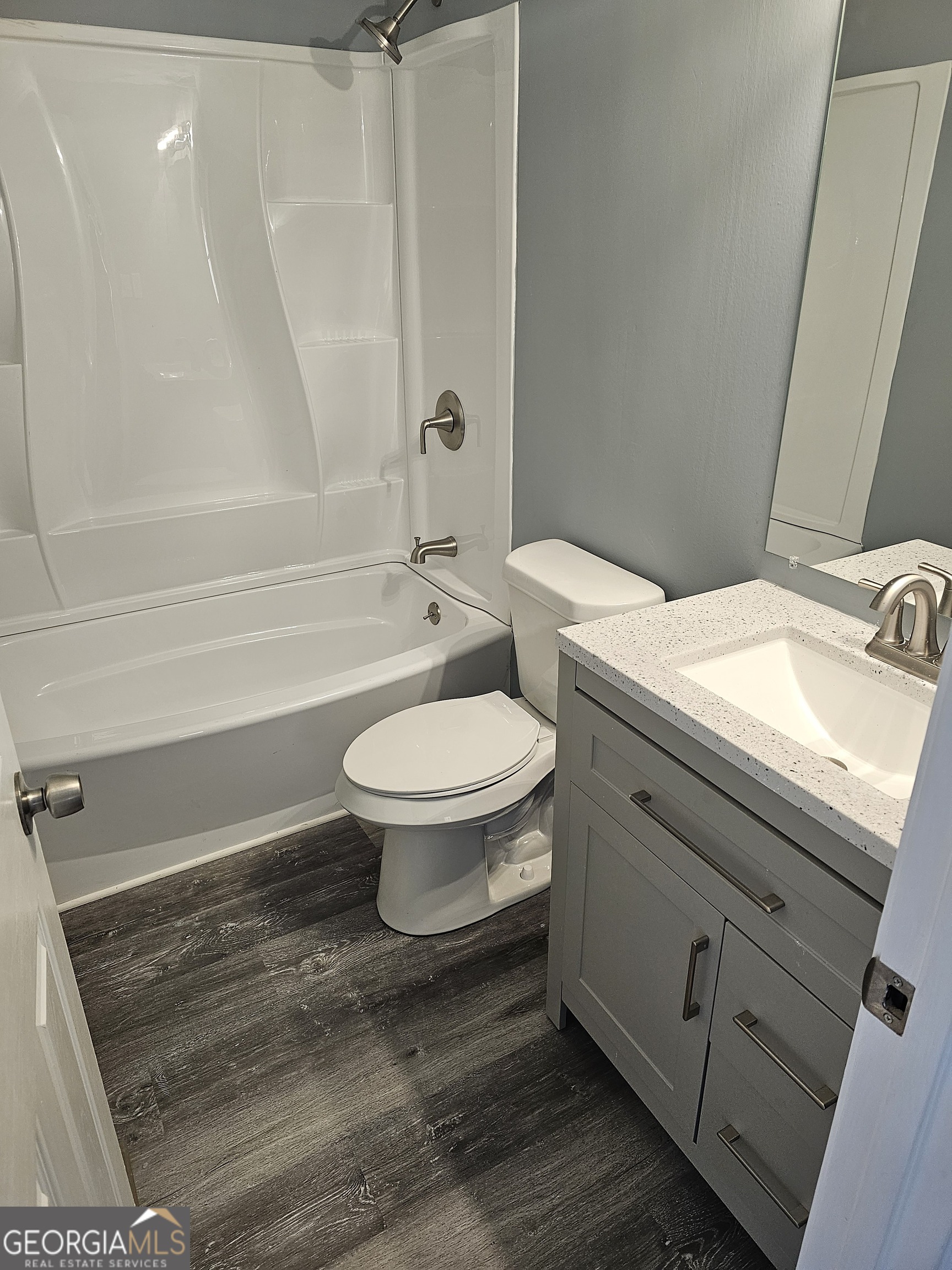 447 High Moon Drive Cartersville, GA 30121 - Photo 4 of 12 a bathroom with a sink a toilet and shower