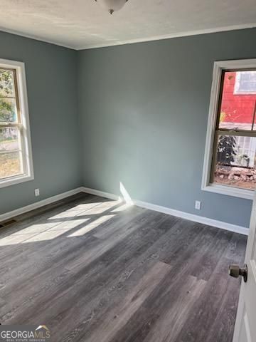 447 High Moon Drive Cartersville, GA 30121 - Photo 6 of 12 an empty room with wooden floor and window