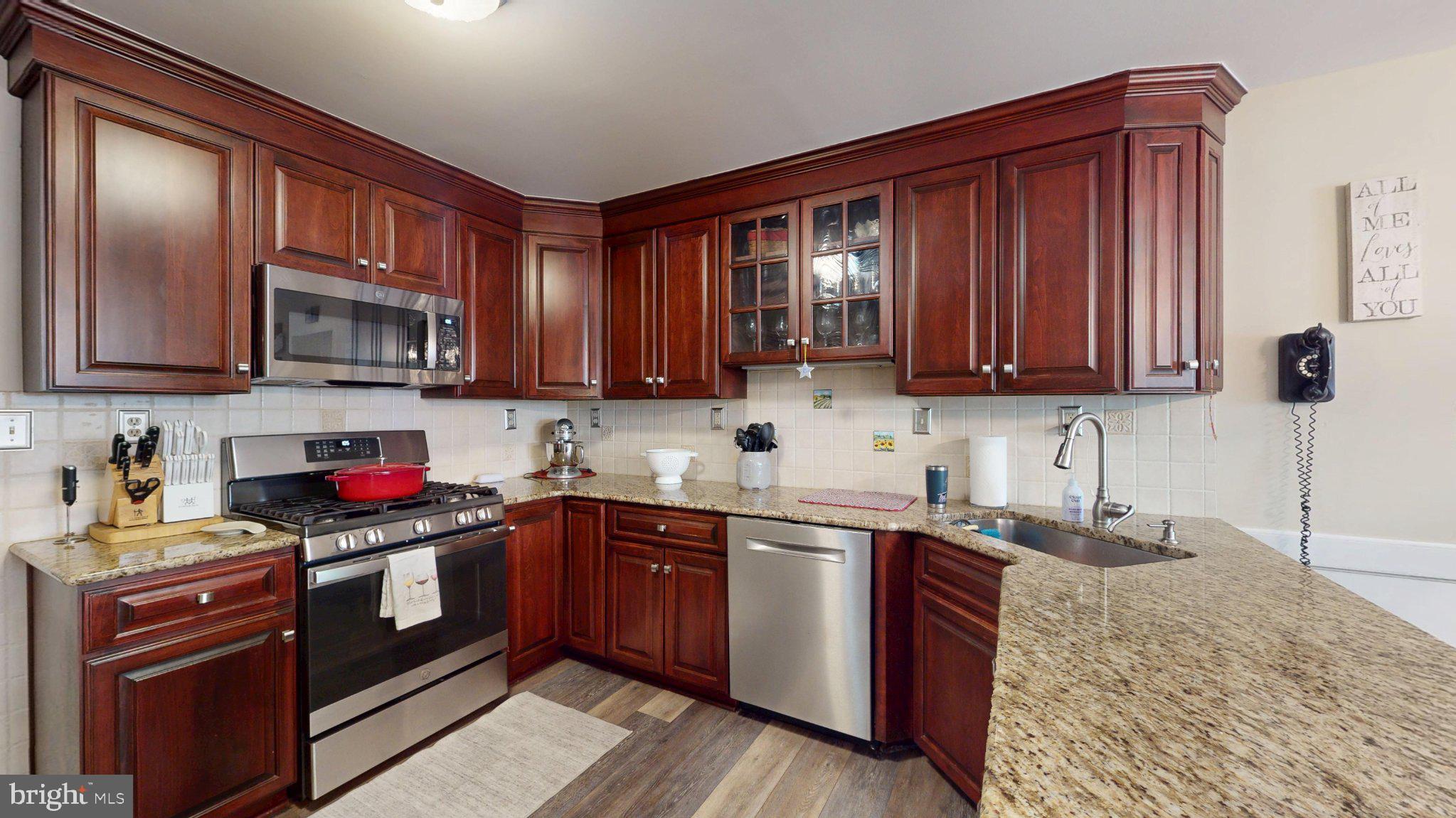 3 Colonial Court Medford, NJ 08055 - Photo 17 of 89 Warm wood tones in a modern kitchen.