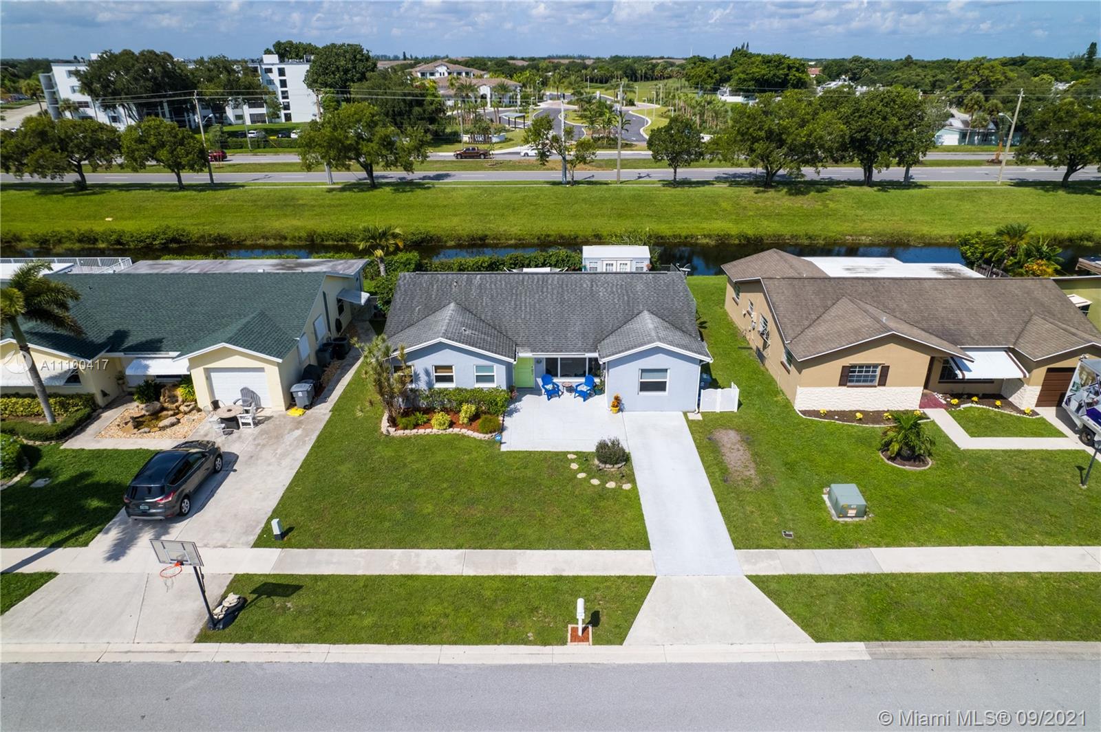 22565 Southwest 56th Avenue Boca Raton, FL 33433 - Photo 2 of 35 front view of a house with a big yard