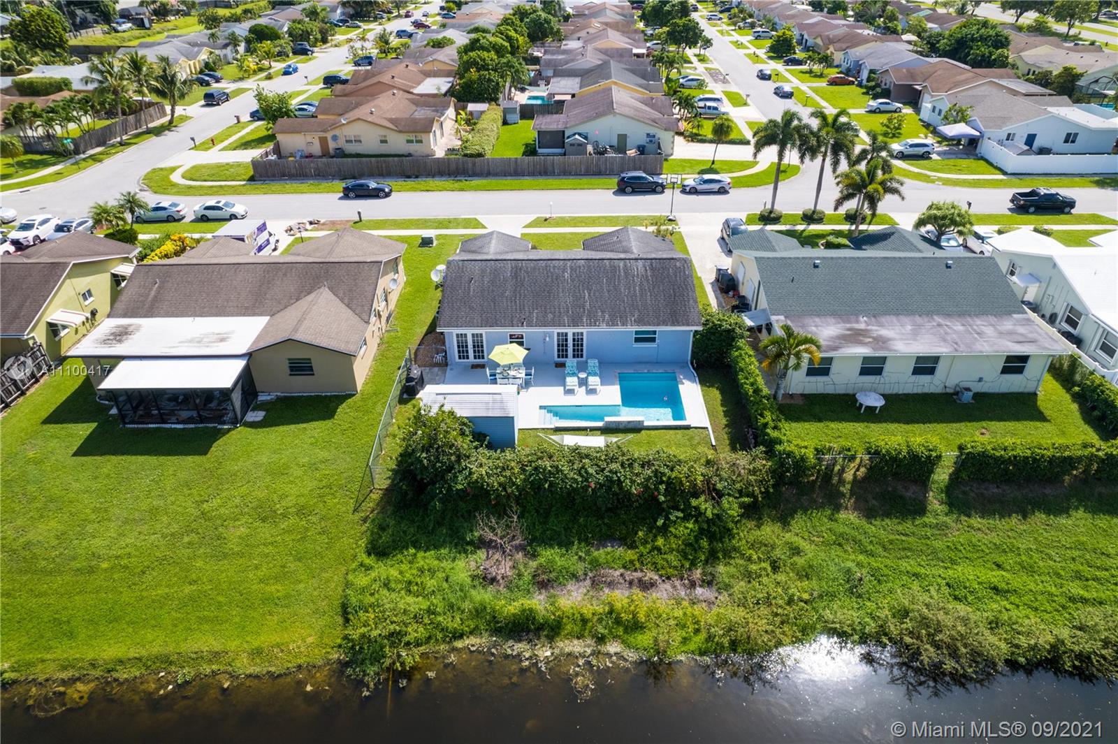 22565 Southwest 56th Avenue Boca Raton, FL 33433 - Photo 11 of 35 an aerial view of a house with a garden and swimming pool