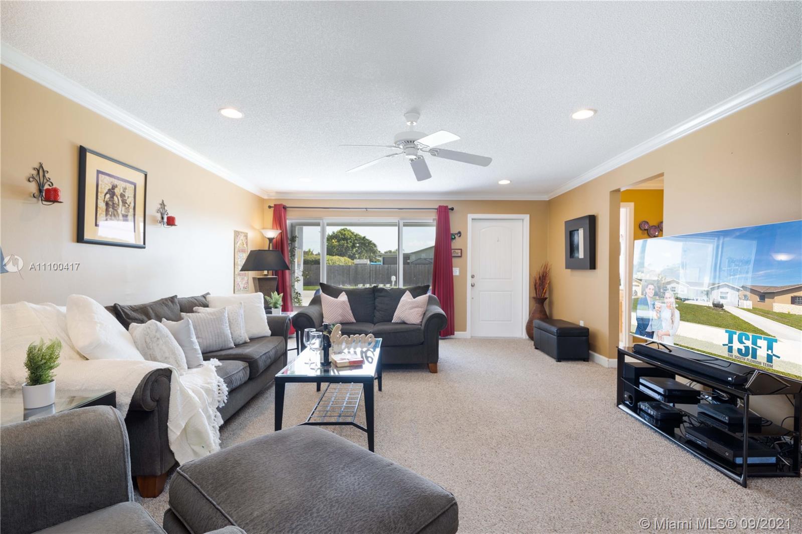 22565 Southwest 56th Avenue Boca Raton, FL 33433 - Photo 13 of 35 a living room with furniture and a window