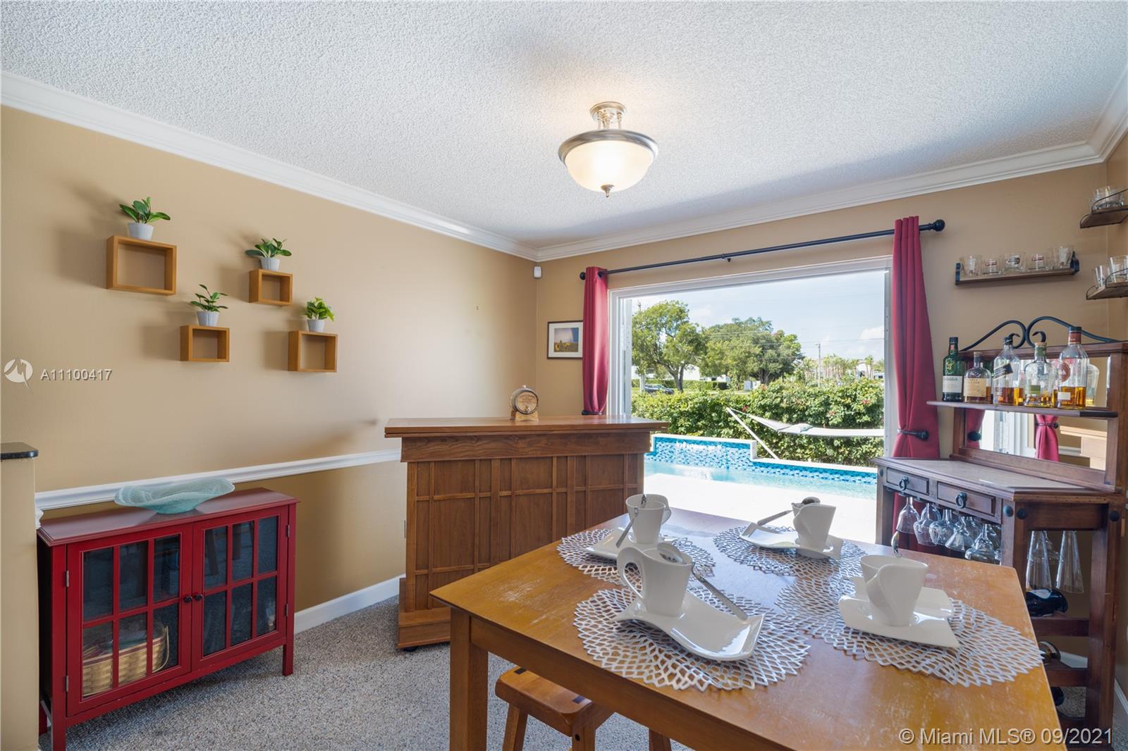 22565 Southwest 56th Avenue Boca Raton, FL 33433 - Photo 17 of 35 a view of a dining room with furniture window and outside view