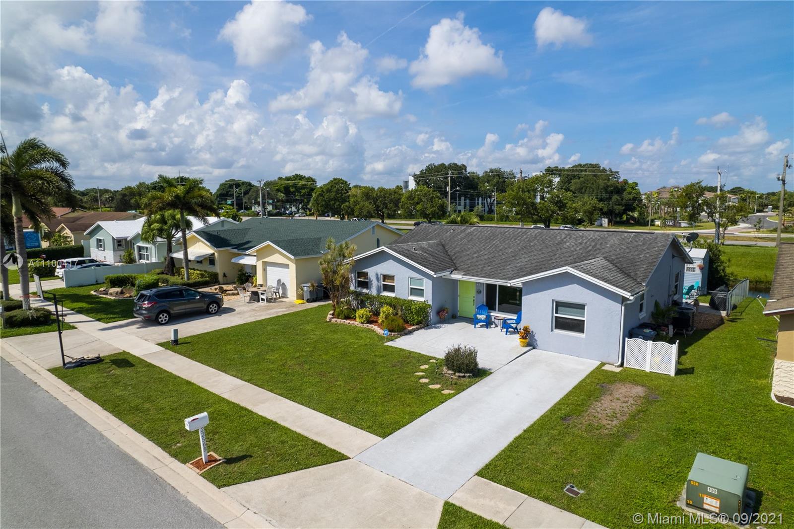 22565 Southwest 56th Avenue Boca Raton, FL 33433 - Photo 3 of 35 a view of house with garden space and street view