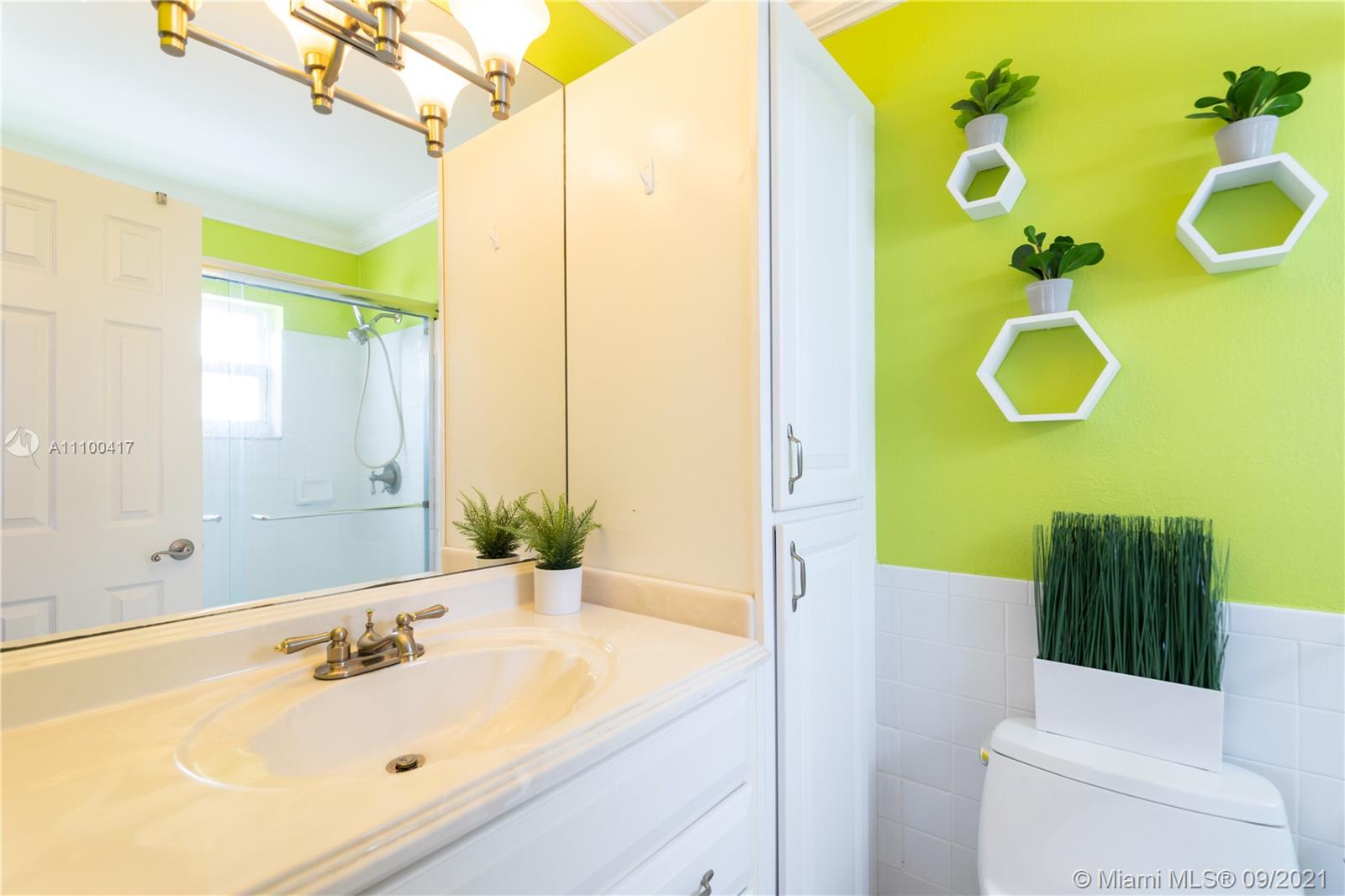22565 Southwest 56th Avenue Boca Raton, FL 33433 - Photo 27 of 35 a bathroom with a sink mirror and toilet
