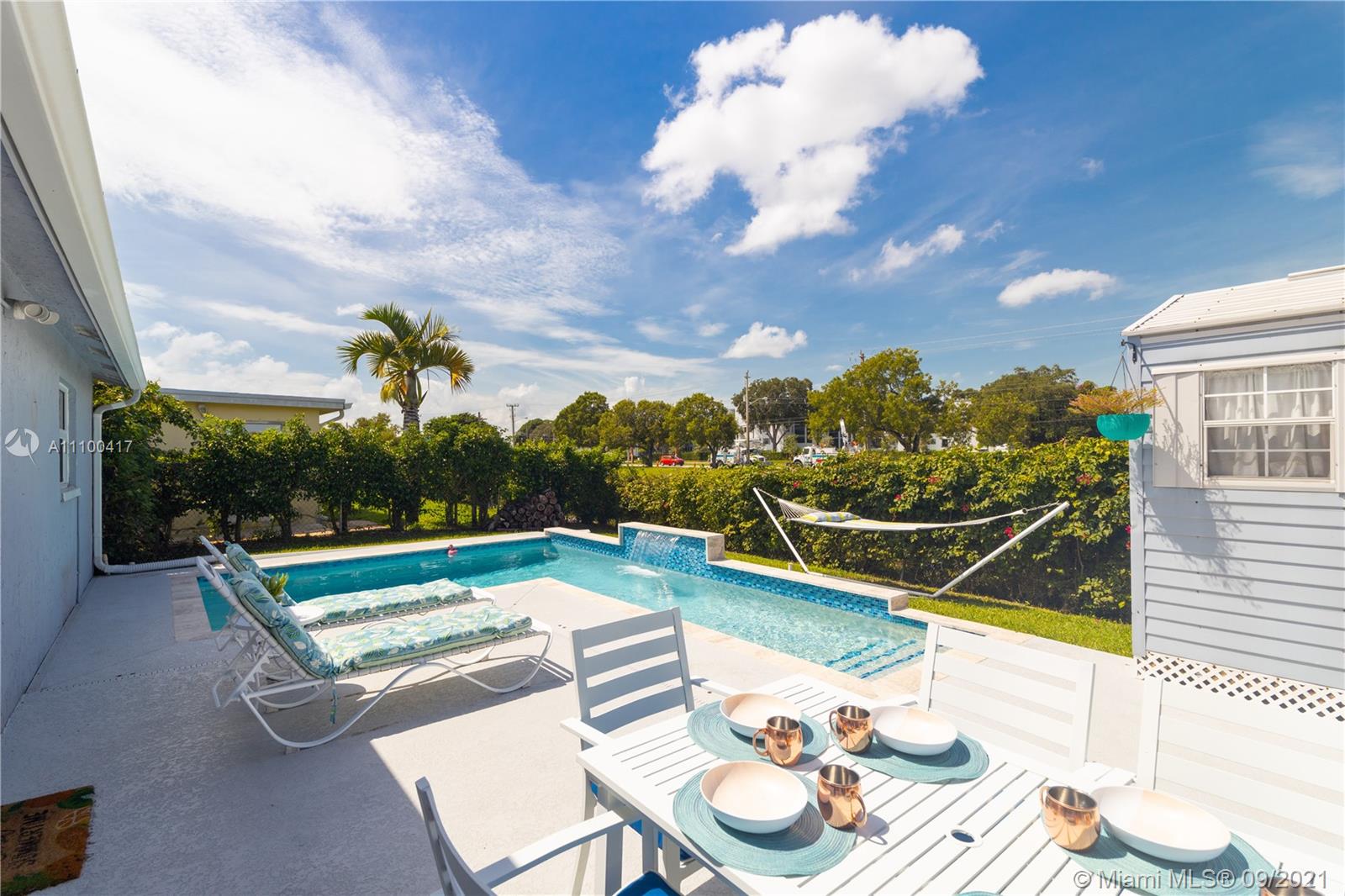 22565 Southwest 56th Avenue Boca Raton, FL 33433 - Photo 29 of 35 a view of a terrace with furniture