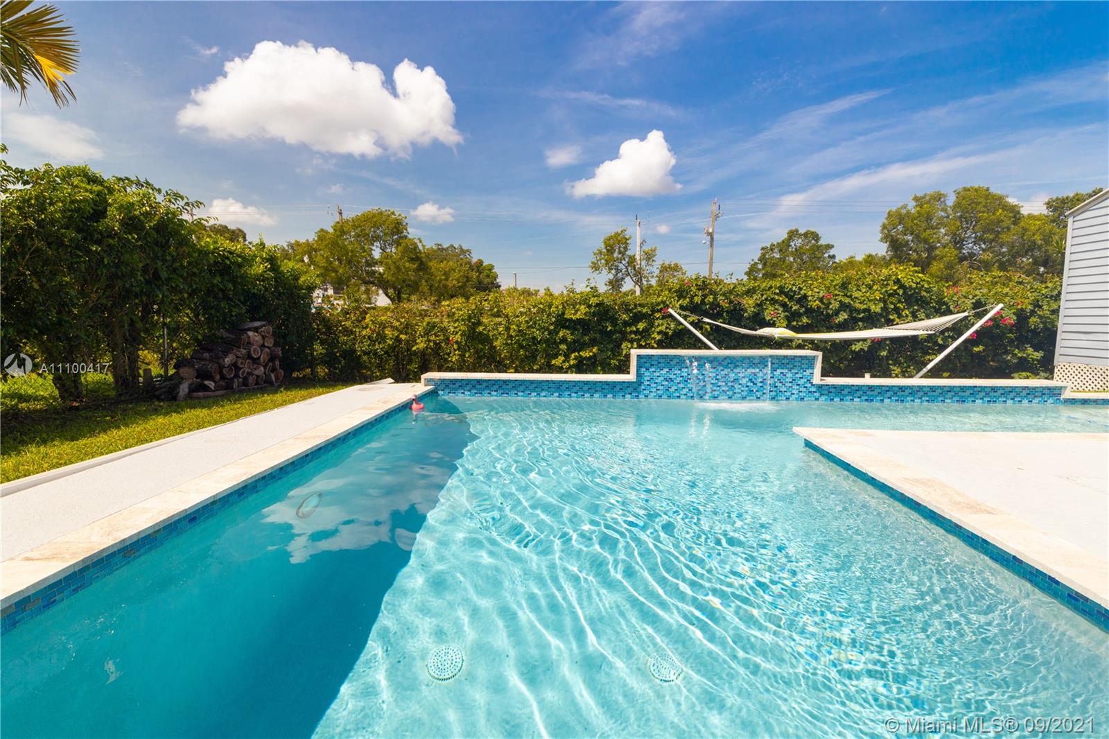 22565 Southwest 56th Avenue Boca Raton, FL 33433 - Photo 31 of 35 a view of a swimming pool with an outdoor seating