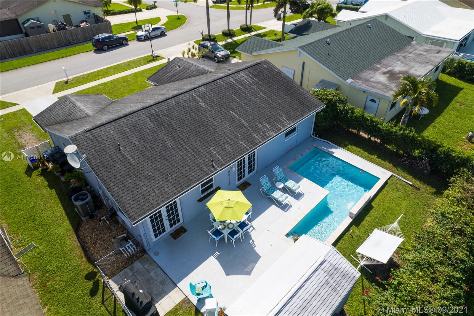 22565 Southwest 56th Avenue Boca Raton, FL 33433 - Photo 10 of 35 an aerial view of a house a yard patio and outdoor seating