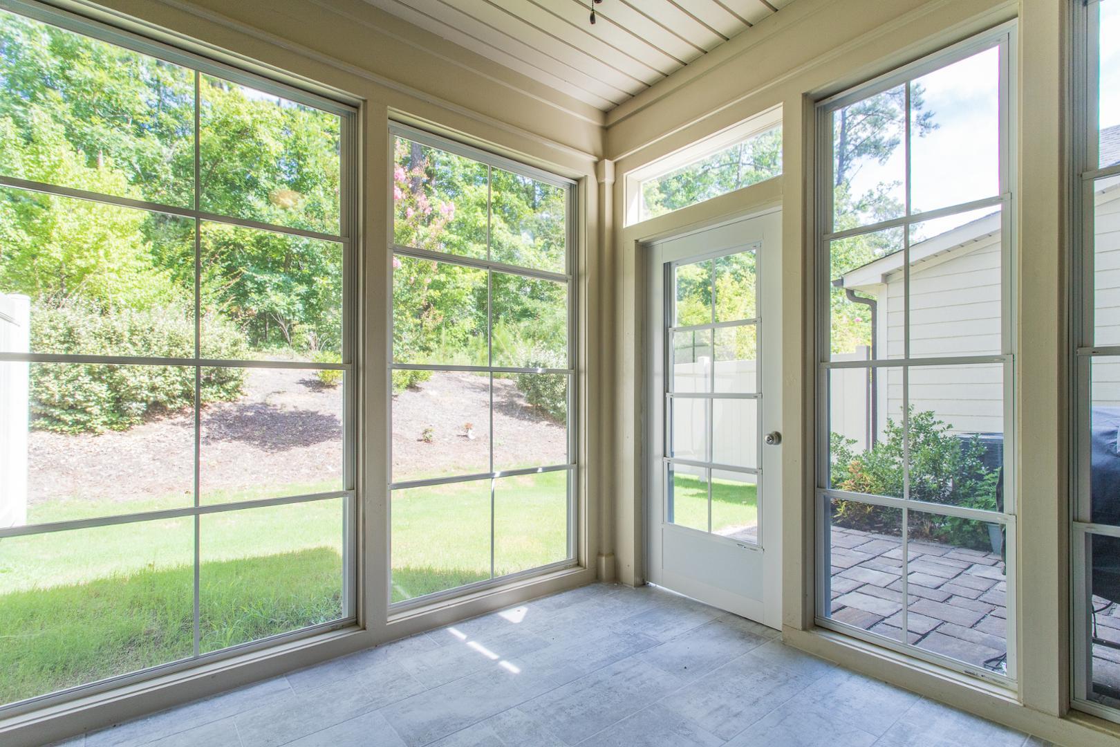 1015 Catch Fly Lane Durham, NC 27713 - Photo 6 of 26 a view of an empty room with wooden floor and windows