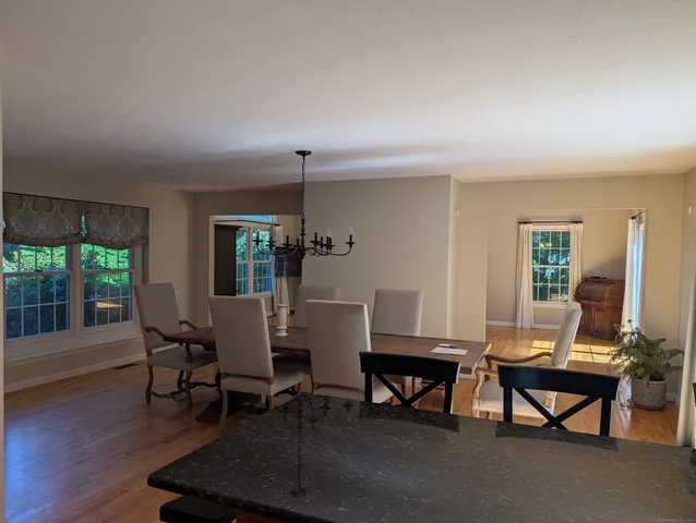 a view of a livingroom with furniture window and wooden floor