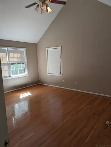 an empty room with a empty space and windows