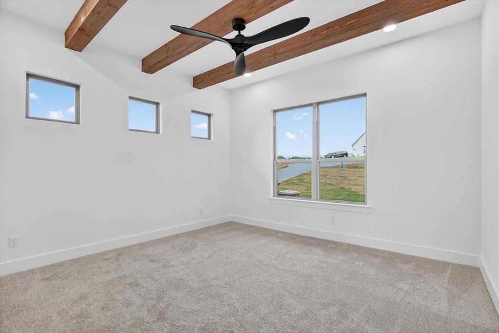 225 Kilkenny Road Poolville, TX 76487 - Photo 15 of 36 Spacious room featuring exposed wood ceiling beams, a ceiling fan, and recessed lighting
