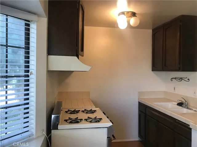 a kitchen with a sink and a stove
