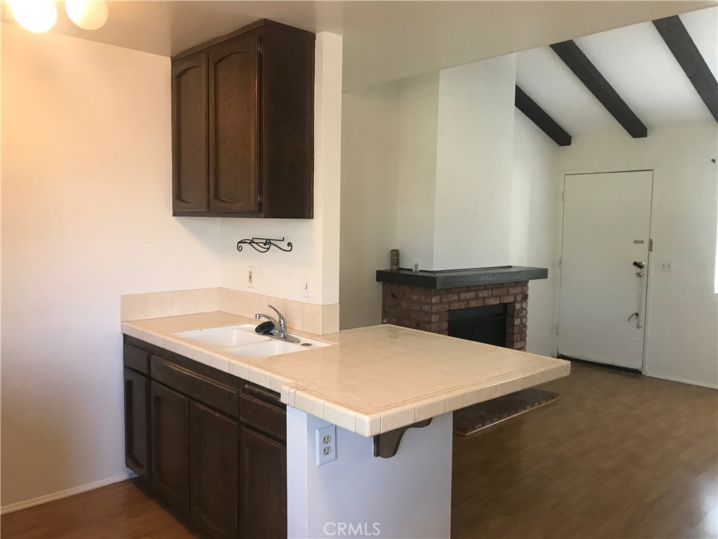 7125 Shoup Avenue, Unit 201 West Hills, CA 91307 - Photo 12 of 16 a utility room with a sink and a mirror