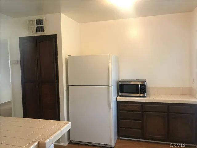 a refrigerator freezer sitting in a kitchen