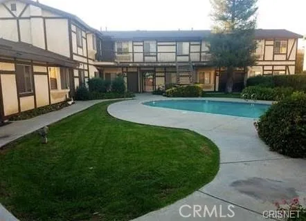 a view of a big building with a garden